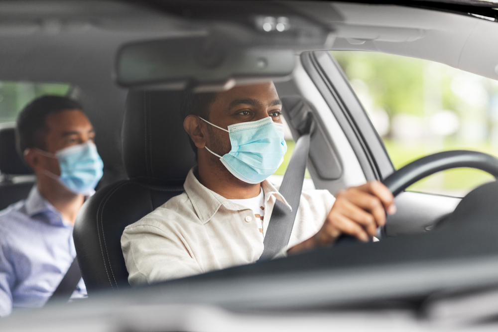 A picture of a EV driver and his co-passenger.